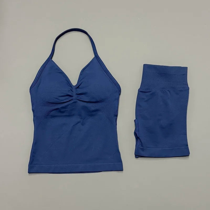 A royal blue women's seamless backless fitness set consisting of a cropped top and matching leggings.