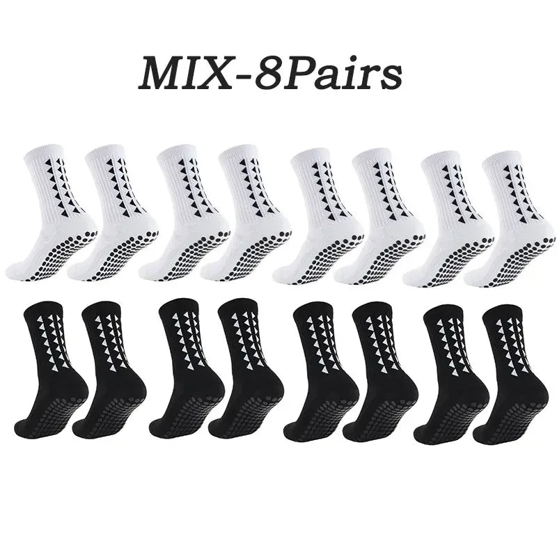 Eight pairs of white athletic grip socks displayed in a row.