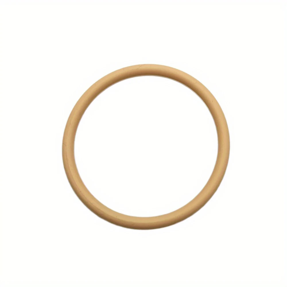 A light tan silicone strap used as a patella stabilizer knee brace.