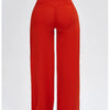 A model wearing red high-waist wide-leg yoga leggings.