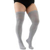 A pair of gray thigh high leg warmers worn on a person's legs.