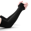 A hand is holding a black compression arm sleeve for sun and UV protection.