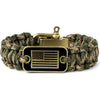 A tactical paracord survival bracelet with a bronze American flag charm and brass clasp.