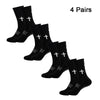 Four pairs of black performance athletic socks for sports and fitness