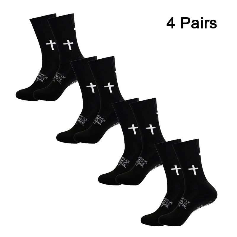 Four pairs of black performance athletic socks for sports and fitness