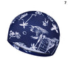 Bonnet de bain bleu foncé avec motif silhouette blanc d'oiseaux et de feuillage.