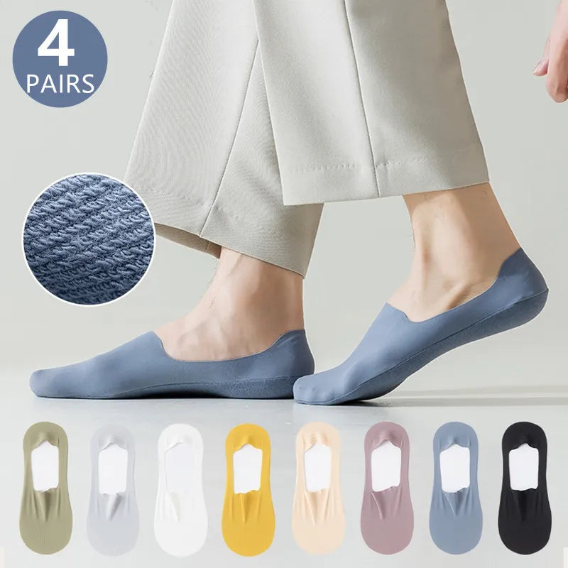 A pair of light blue men's invisible boat socks shown on a foot, with various color options displayed below.