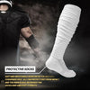 White protective socks worn by a football player, showing the texture and fit of the socks.