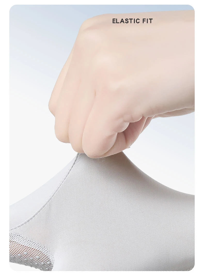 A hand wearing an elastic fit glove is shown pressing down on a white fabric surface.