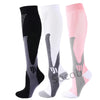 Three pairs of compression socks in black, white, and pink for athletes and medical use