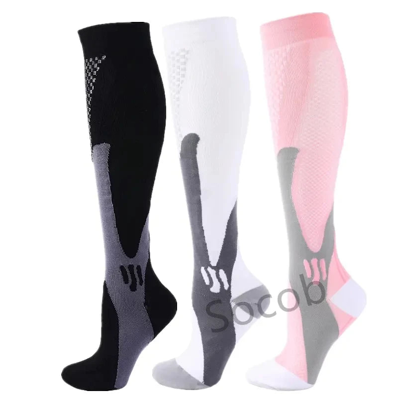 Three pairs of compression socks in black, white, and pink for athletes and medical use