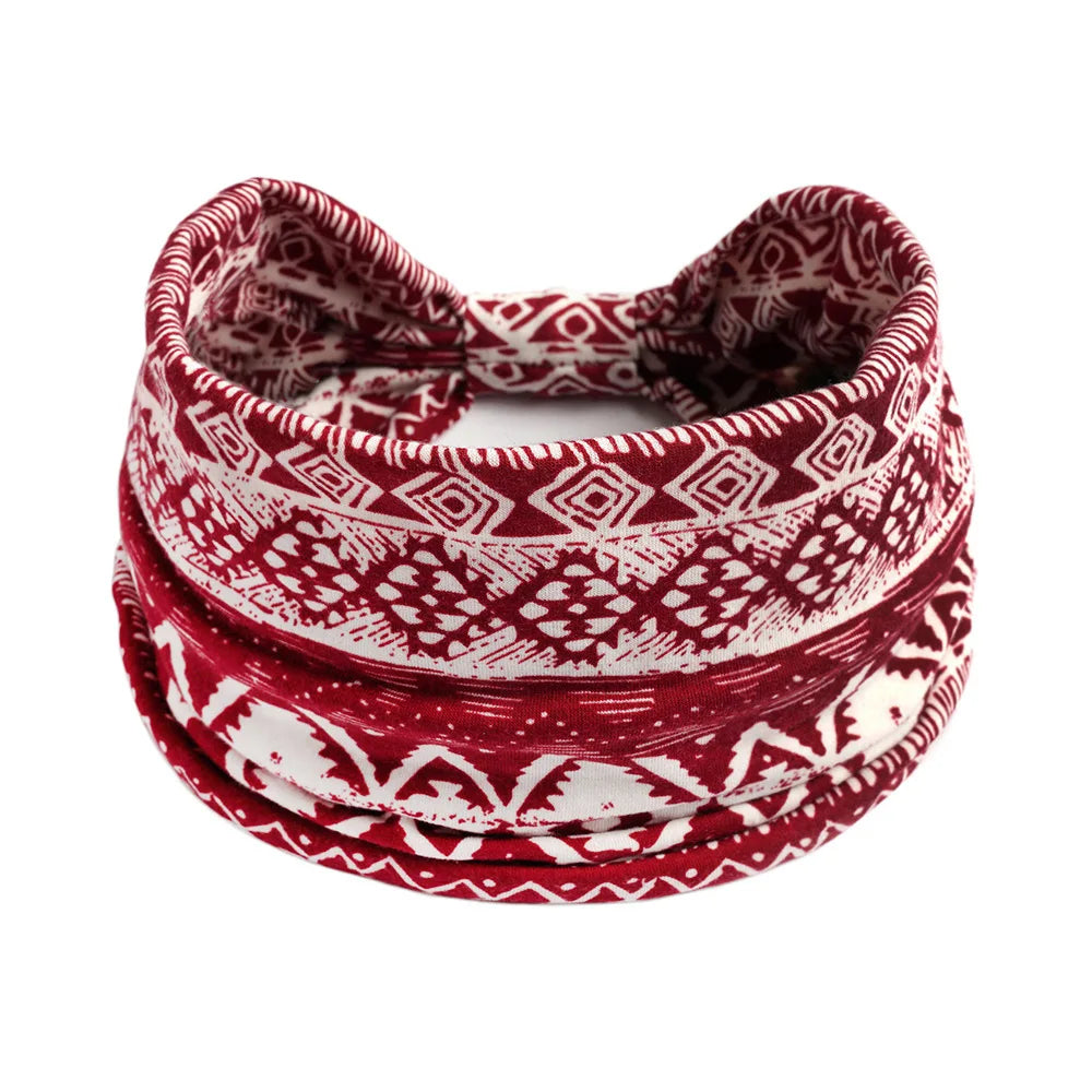 A stack of red and white bohemian cotton stretch headbands.
