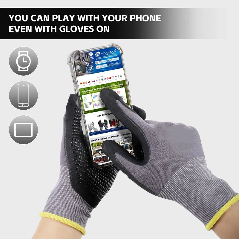 A hand wearing gray nitrile coated safety work gloves is holding a smartphone displaying an application.