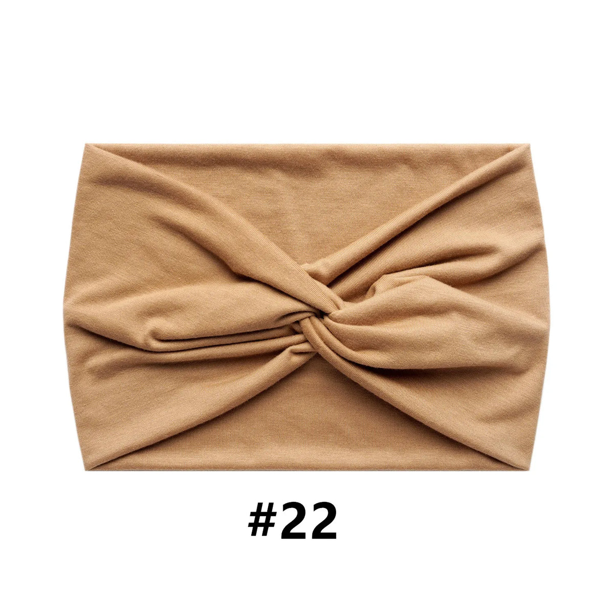 A beige boho wide turban headband folded into a knot.
