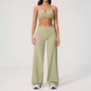 A woman wearing a light olive green women's premium fitness tracksuit top and matching pants.