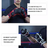 Person in black clothing holding red and black MMA training boxing gloves