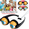 A pair of funny novelty glasses toy with orange frames and blue lenses