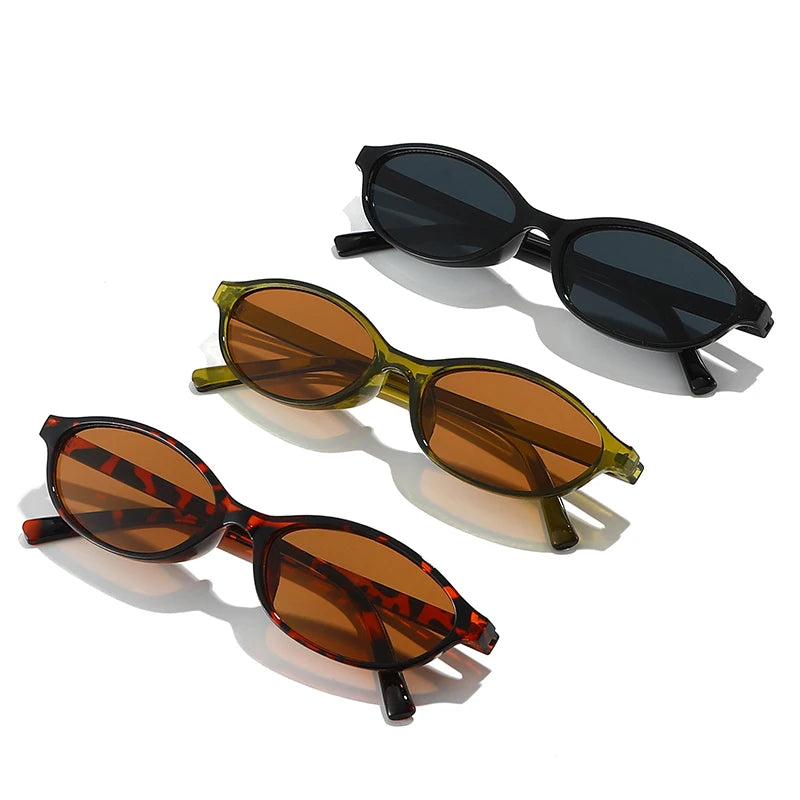 A set of retro oval frame sunglasses in black and amber tortoiseshell patterns.
