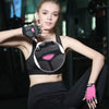 A young woman models pink and black breathable anti-slip fingerless gloves for sports activities.