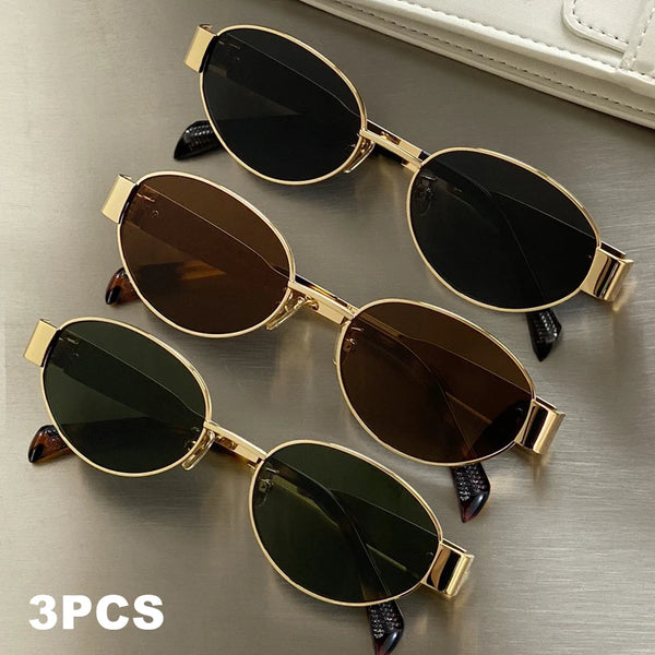 Three pairs of classic oval metal sunglasses in gold and black frames are displayed on a neutral surface.