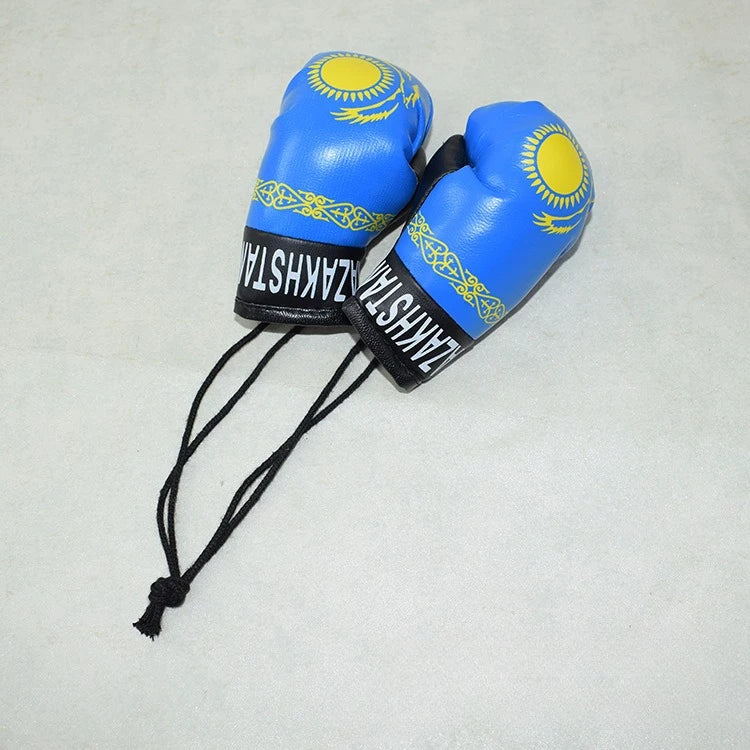 Blauer Mini-Leder-Boxhandschuh-Anhänger mit goldener Sonnenverzierung und ZAKHSTAN-Text