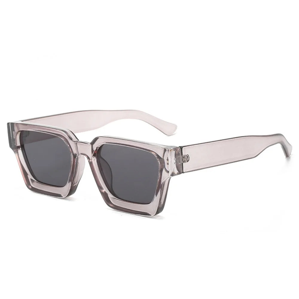 Clear pink retro square frame sunglasses with dark lenses and light pink arms