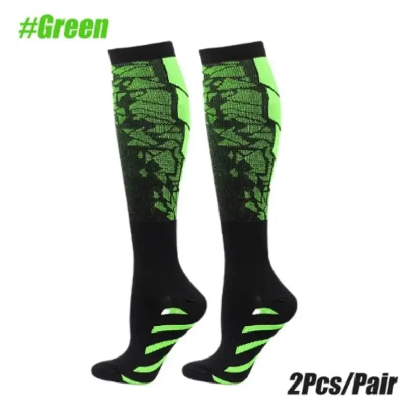 Pair of black compression socks with neon green accents for sports or athletic use