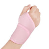 A pink adjustable wrist support brace worn on a hand and wrist.