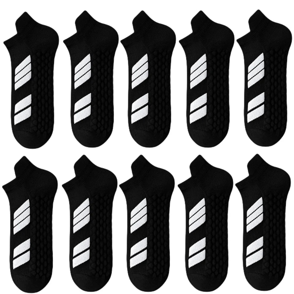 Un paquet de dix chaussettes de sport noires et blanches à coupe basse, présentées individuellement.