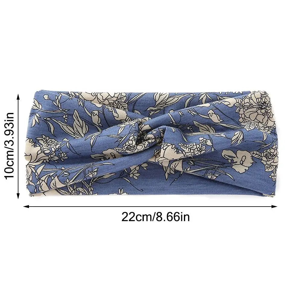 Diadema de tela elástica floral azul con un delicado estampado