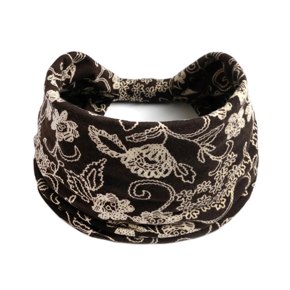 A black and white floral patterned stretch fabric headband
