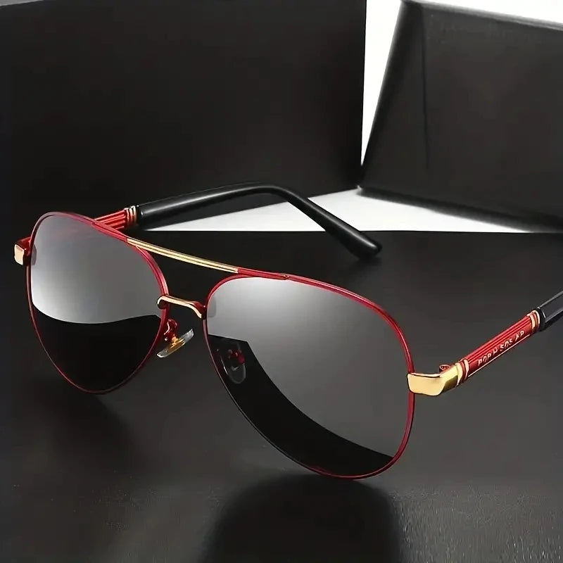 A pair of red-framed polarized sunglasses with black lenses resting on a black surface.
