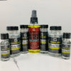 A collection of Walker Tape Ultra Hold lace wig glue bottles in various sizes and colors.