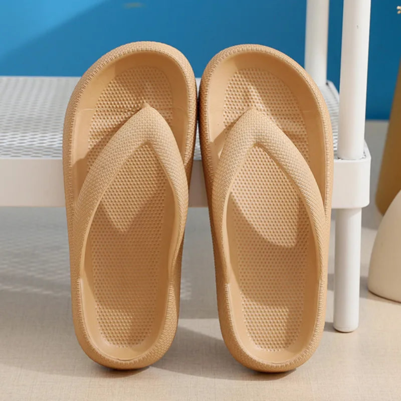 Pair of beige comfort platform flip flops resting on a white surface.