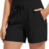Black high-waisted quick-dry athletic shorts worn by a woman.