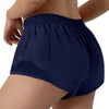 Navy blue women's high-waisted running shorts worn by a model.