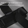 Black adjustable hook and loop strap with a padded wrist wrap shown in close-up.