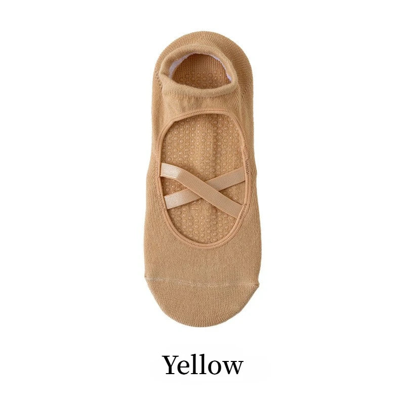 Tan yoga socks with a crisscross strap design