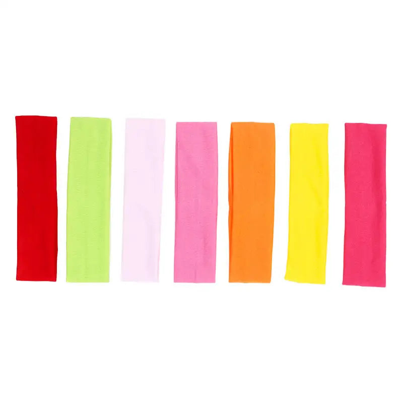 A set of solid elastic hair bands in red, lime green, pink, orange, and yellow.