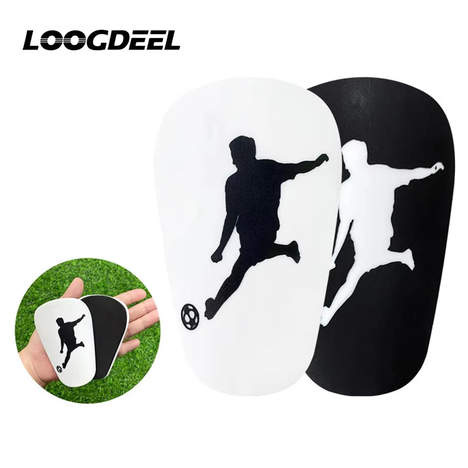 A pair of black and white mini wear-resistant shin guards for soccer and sports