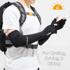 A person wearing a white shirt and backpack is shown with black UV protection arm sleeves on their arms.