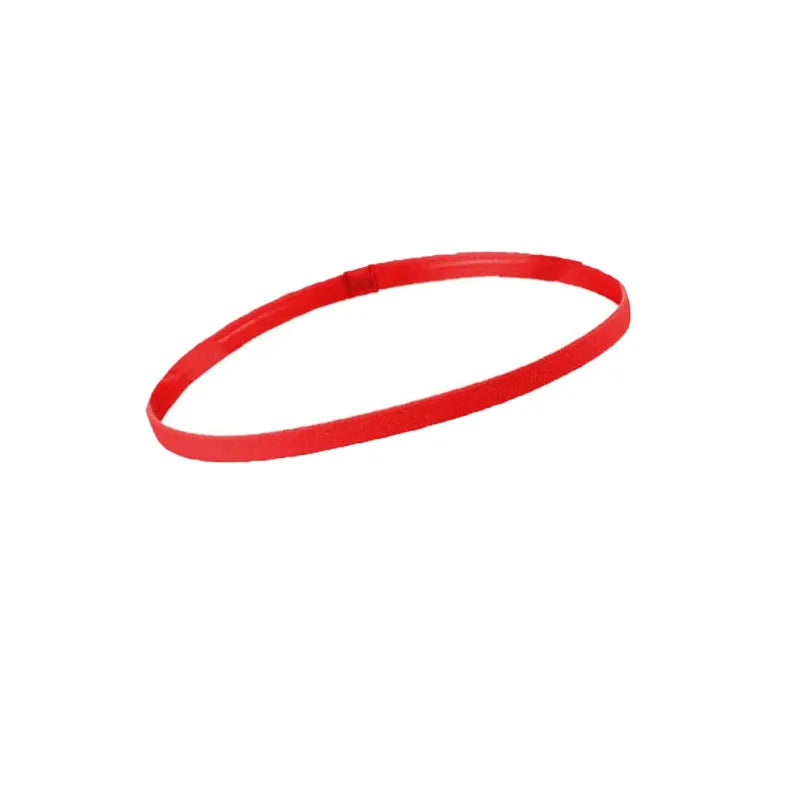 A set of five red multi-functional elastic sports headbands laid out flat.