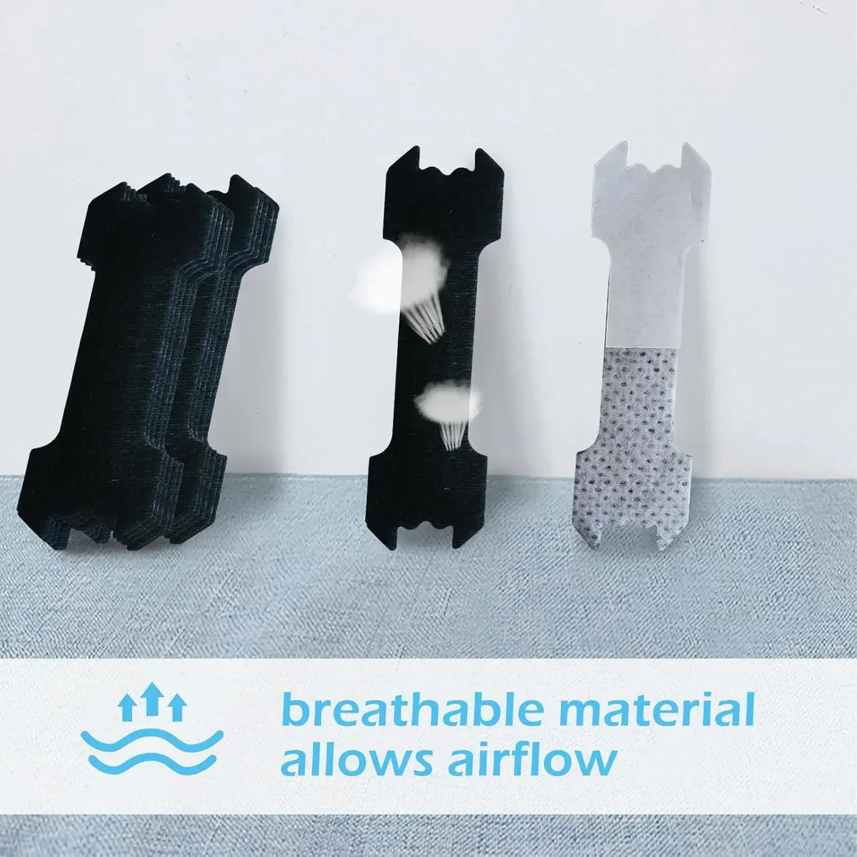 Three black and gray invisible nasal strips shown against a light background, demonstrating airflow.