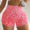 Pink leopard print high-waist seamless shorts worn by a person.