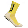 Calcetines deportivos amarillos para hombre con puntos negros y dobladillo beige