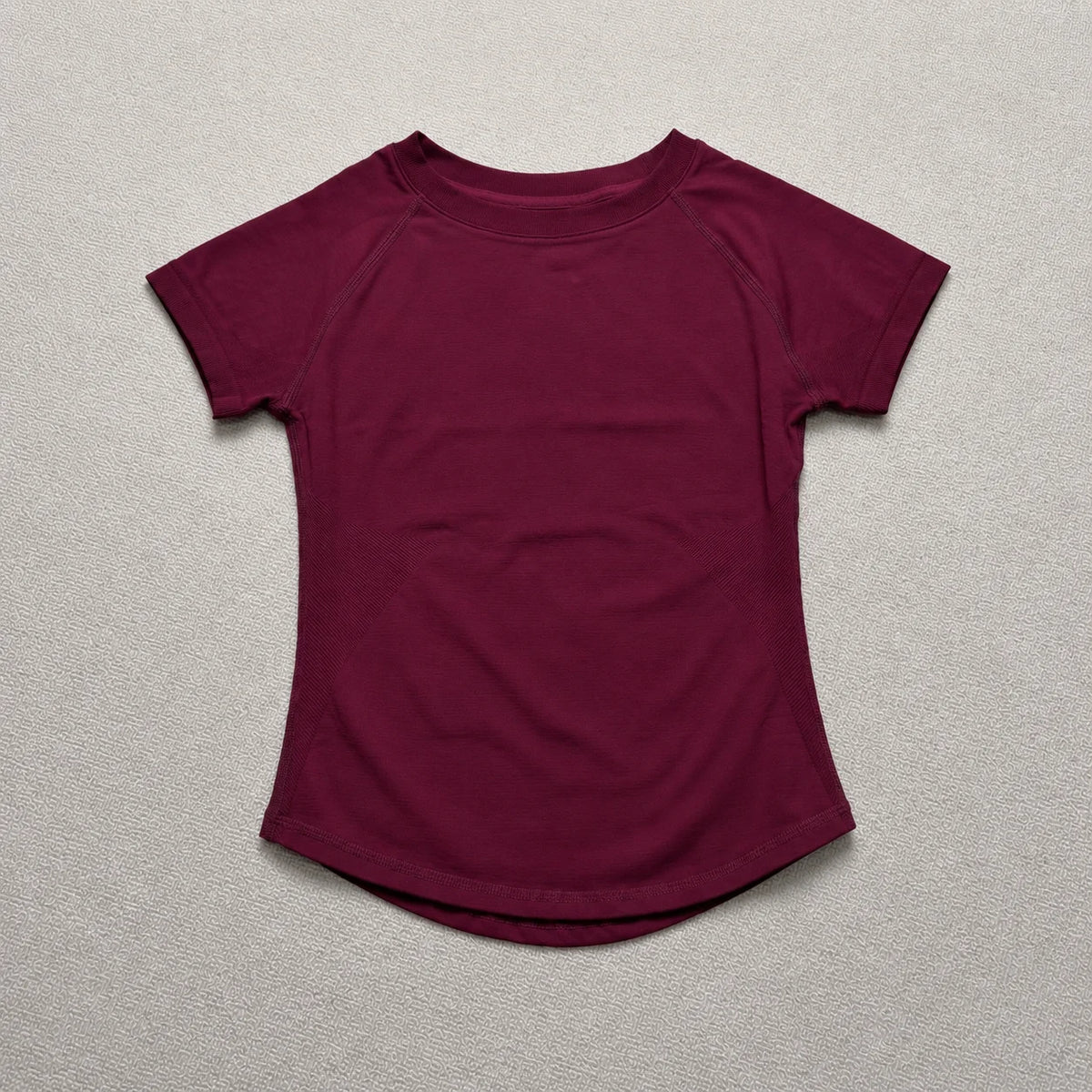 A maroon short-sleeved t-shirt top for a seamless high-waist yoga set.