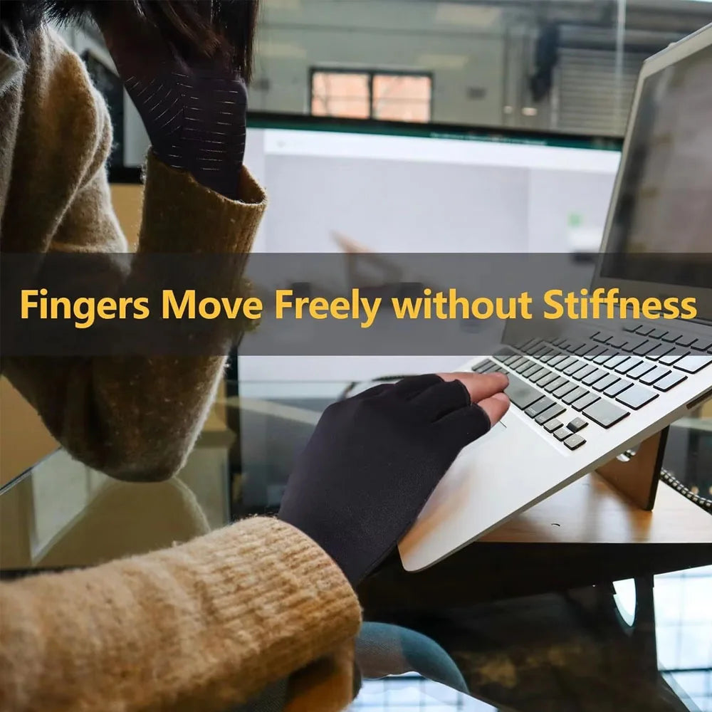 A person wearing dark gloves is using a laptop, demonstrating fingers moving freely without stiffness.