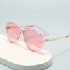 Pink tinted fashion protective sunglasses resting on a white surface.