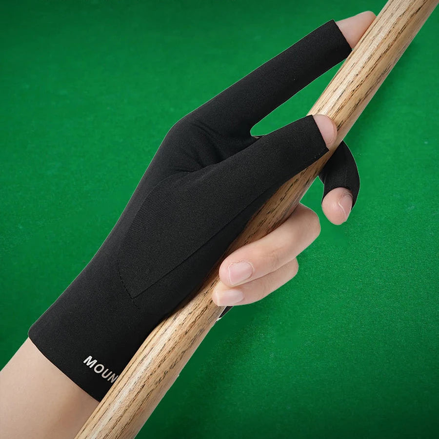 A hand is holding a wooden billiard cue with a black protective glove on the hand.