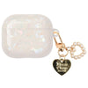 A clear, iridescent white protective case for AirPods Pro attached to a gold chain with a heart pendant.